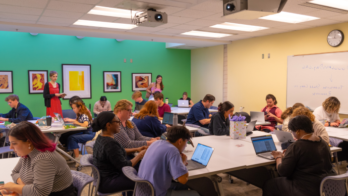 students transcribing on laptops in Coates Library