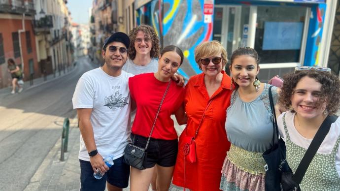 President Beasley poses for a photo with students on the streets of Madrid