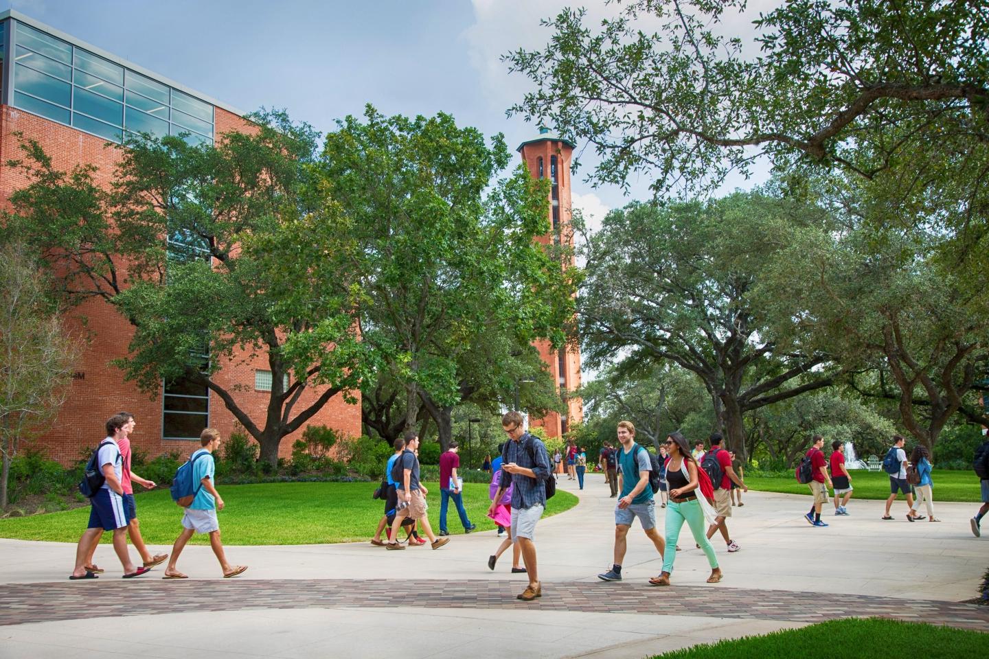 Photo of students walking outdoors through campus